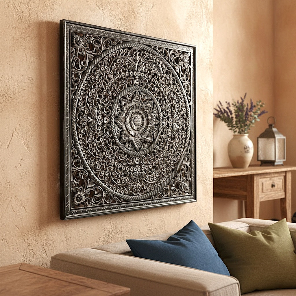 Decorative wall art piece on a beige wall above a sofa with pillows.